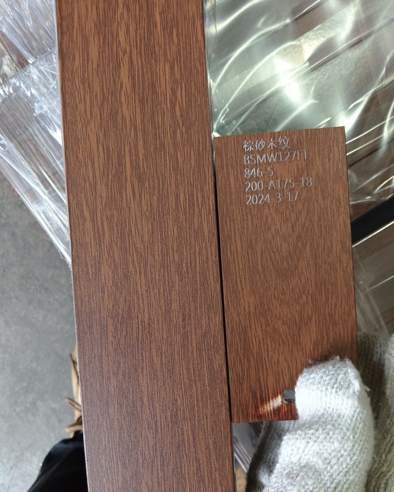Wood grain transfer finish sample next to its reference label